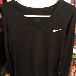 Nike long sleeve dri-fit with thumb holes.
